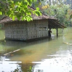 Salah satu rumah di Desa Tlaga terendam luapan air sumur.