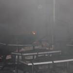 LUDES - Perabotan seperti meja dan kursi tampak gosong usai api membakar restoran sekaligus swalayan Sidodadi. (foto: suwandi/BANGSAONLINE)