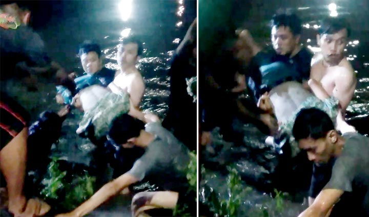 Warga membantu mengevakuasi korban yang tenggelam di Kali Pucang Sidoarjo.