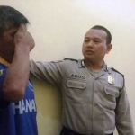 Tersangka Edi Sulistiono saat diamankan.