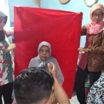 Program jemput bola perekaman e-KTP untuk Disabilitas dan Lansia yang merupakan inovasi Dispendukcapil Sidoarjo. Program itu diberi nama Dilan.