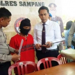 Markawi dan barang bukti saat diamankan. foto: humas polres