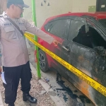 Polisi saat di lokasi kejadian yang berada di Dusun Lembana, Desa Kombang, Kecamatan Talango, Sumenep. 