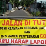 Satu ruas jalan di Kelurahan Rembang di-lockdown atau karantina untuk menghindari penularan semakin meluas.