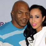 Mike Tyson bersama istrinya, Lakiha Spicer. foto: https://www.youtube.com/watch?v=sPqdMVIyHPI/factsninja.com