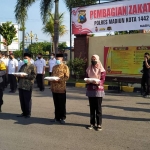 Apel pembagian zakat di Mapolres Madiun Kota, Senin (10/5/2021).