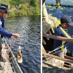 Petugas mengambil sampel air sungai Bengawan Solo yang tercemar dan berubah warna menjadi merah.