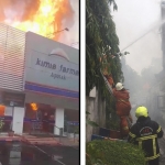 Petugas pemadam kebakaran (PMK) saat melakukan pemadaman Apotek Kimia Farma Diponegoro, Surabaya.