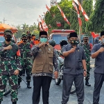 Drs. Mohni, M.M., Wakil Bupati Bangkalan bersama Forkopimda usai apel kesiapsiagaan penanggulangan bencana hidrometeorologi tahun 2020 di Kabupaten Bangkalan, Jumat (23/10/2020). (foto: ist)