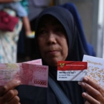 Ilustrasi Penerima Bantuan PKH dan BPNT melalui KKS Merah Putih atau Himbara.