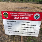 Papan proyek di Desa Gandul, Kecamatan Pilangkenceng, Kabupaten Madiun.