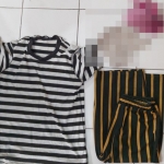 Barang bukti baju dan celana serta pakaian dalam korban.