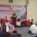 Bupati Gresik, Fandi Akhmad Yani memberikan sambutan saat hadir di bukber PDIP Gresik. Foto: SYUHUD/ BANGSAONLINE