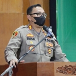 Kapolres Pasuruan AKBP Erick Frendriz saat memimpin pembukaaan bersama Forkopimda jelang Natal dan Tahun Baru 2022 mendatang. foto: ANDI F/ BANGSAONLINE