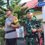 Kapolres Pacitan AKBP Sugandi dan Dandim Pacitan Letkol (kav) Aristoteles Hengkeng Nusa Lawitang saat gelar apel.