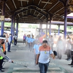 Penyemprotan disinfektan di Terminal Purabaya.