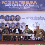 H. Syafiuddin, Anggota Komisi V DPR RI (tiga dari kanan) bersama KH. Hasani Zubair (dua dari kiri) dalam acara Podium Terbuka menyambut Perpres Nomor 80 Tahun 2019.