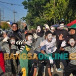Komunitas Ruang Pantomim saat meramaikan CFD Bangkalan, Minggu (7/6/2026)
