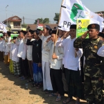 Ribuan santri saat mengikuti upacara peringatan HSN di Lapangan Sukorejo, Kecamatan Sumbersari, Jember, Jawa Timur, Selasa (22/10/2019) pagi.