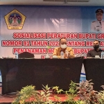 Kepala DPMPTSP Gresik, AM Reza Pahlevi, saat memberi sambutan dalam sosialisasi Perbup No 91 tahun 2021. Foto: SYUHUD/BANGSAONLINE