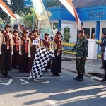 Danramil 0803/08 Mejayan, Kapten Inf Heru Purnomo melepas peserta Lomba Gerak Jalan HUT RI, Rabu (21/8/2019).