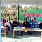 Masruri Abdul Ghoni, Ketua JKSN Pacitan saat membuka bazar murah di Desa Bomo, Kecamatan Punung.