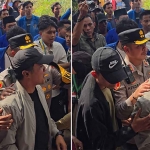 Bupati Bangkalan Lukman Hakim (kanan pakai topi) didampingi Kapolres AKBP Hendro Sukmono saat hendak keluar dari kerumunan aksi mahasiswa Cipayung Plus di pintu masuk Gedung DPRD Bangkalan, Senin (1/9/2025).