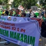 Demo yang digelar komunitas ojol atau ojek online di Jombang.