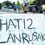 Ilustrasi pemberitahuan jalan rusak.