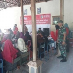 Bantuan PKH yang dibagikan di Balai Desa. 