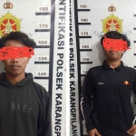 Pelaku pengeroyokan yang berinisal MRG dan DRA, warga kedurus saat diamankan Polsek Karang Pilang. 