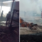 Petugas pamadam kebakaran saat melakukan pembasahan.