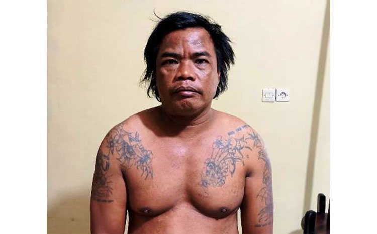 Tersangka Jumari diamankan di Mapolsek Grogol. 