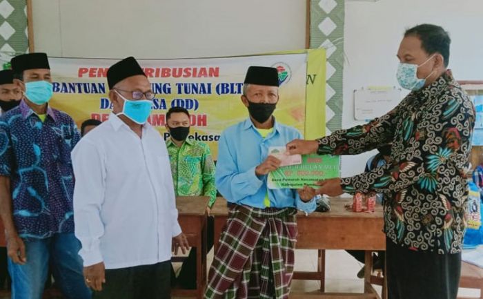 Desa Pamoroh Salurkan BLT-DD Tahap II kepada Warga Terdampak Covid-19 Desa Pamoroh Salurkan BLT-DD Tahap II kepada Warga Terdampak Covid-19