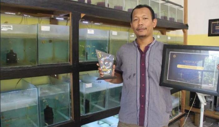 Programmer Komputer yang Kini Beralih Profesi sebagai Seorang Peternak Ikan Programmer Komputer yang Kini Beralih Profesi sebagai Seorang Peternak Ikan