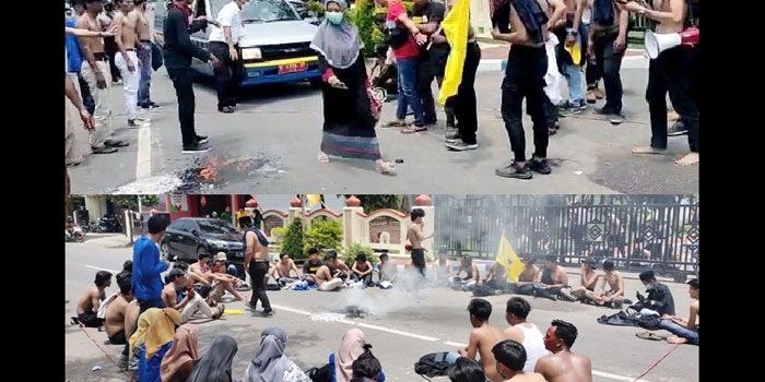 Puluhan Aktivis PMII Universitas Wiraraja saat menggelar aksi dengan bertelanjang dada di depan Kantor Pemkab Sumenep.