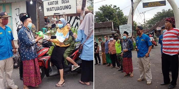 Agus Suyanto bersama relawan saat bagi-bagi sarung dan nasi bungkus kepada warga dan pengendara yang melintas di Jalan Raya Wisata Taman Safari.