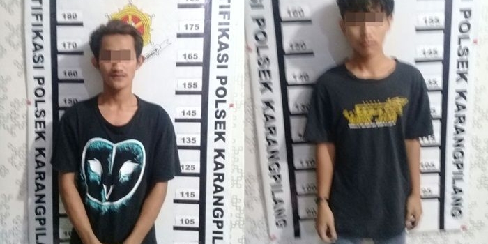 Kedua tersangka saat proses identifikasi.