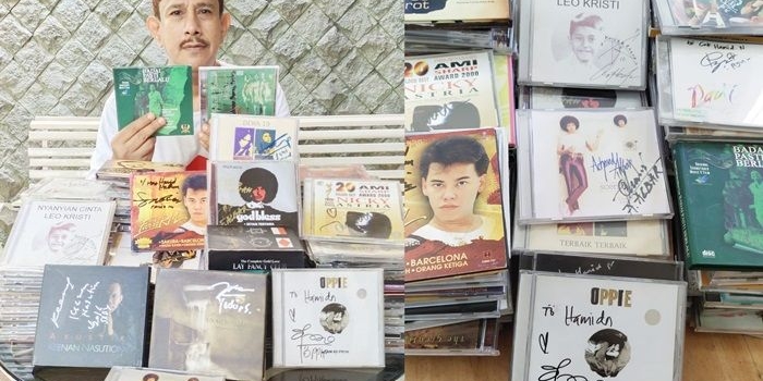 Hamid Nabhan bersama ribuan koleksi Compact Disc (CD) miliknya berikut tanda tangan penyanyi aslinya.