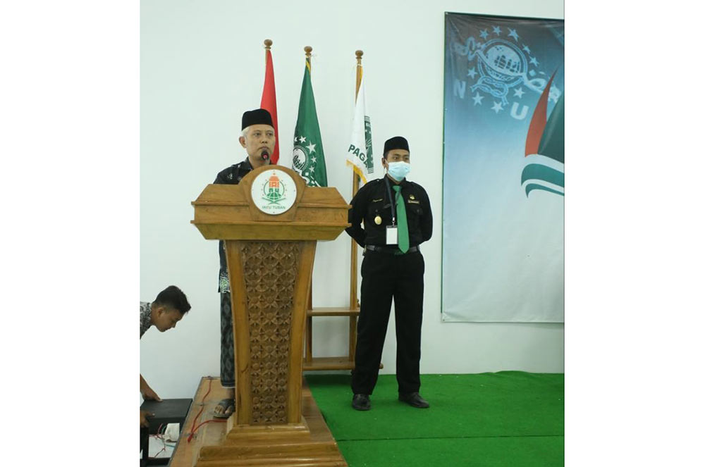 Ketua PC PSNU Pagar Nusa Tuban periode 2021-2026, Muhammad Abdul Mujib, saat memberi sambutan dalam agenda Konferensi Cabang ke-3.