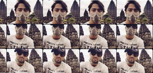 Shaheer Sheikh saat ke Candi Prambanan menutupi wajahnya dengan masker dan topi.